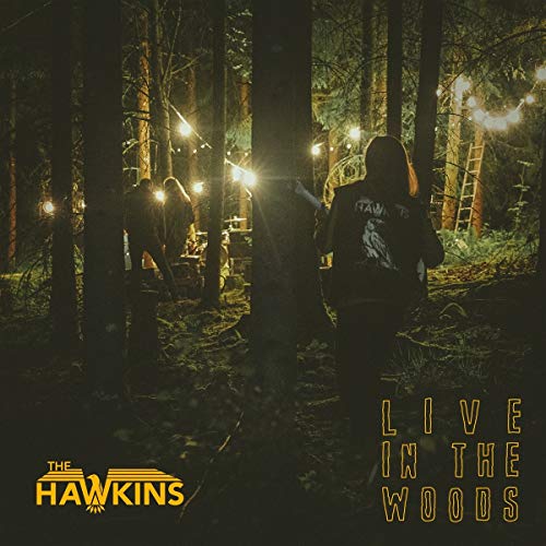Vinyl album cover: silhouetted figures with headlamps in a dark forest, text "The Hawkins Live in the Woods".