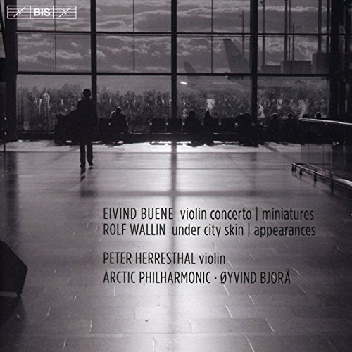 Black and white image of a CD cover featuring a man walking in a large room.