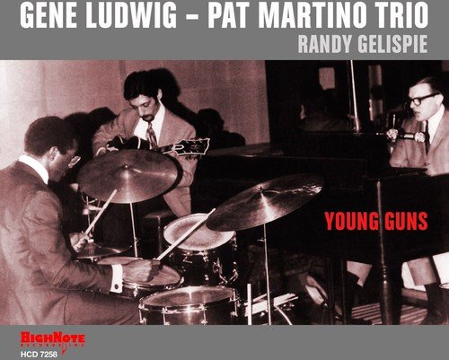 "Album cover featuring a black and white photo of three musicians performing on stage together."