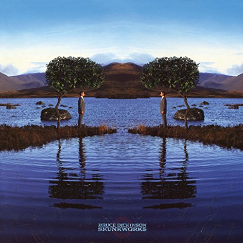 Album cover with two men standing on small islands in a serene lake scene.