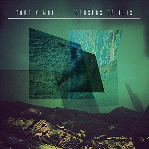 "Album cover with abstract green and blue geometric shapes and rocky landscape."