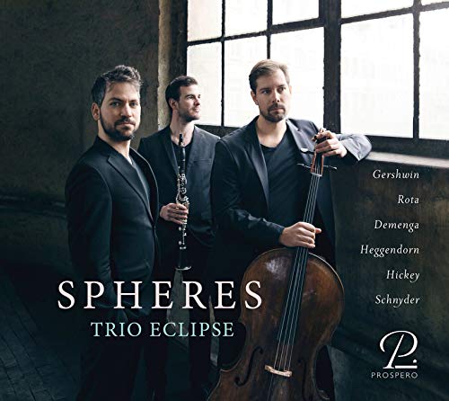 "CD cover featuring three men in black holding musical instruments."