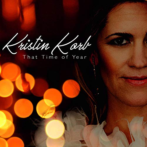 Album cover with a woman's face and festive lights, titled "That Time of Year".