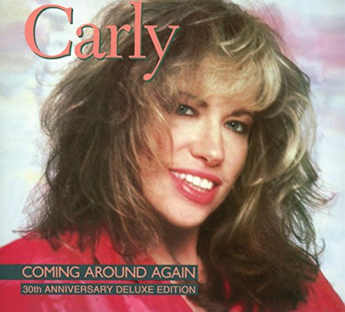 "CD cover featuring a smiling woman with curly hair, wearing a red top."
