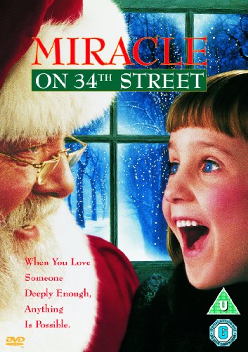DVD cover featuring Santa Claus and a young girl looking out a snowy window.