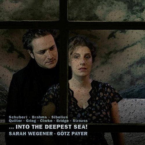 CD cover featuring a man and woman standing behind a gridded window.