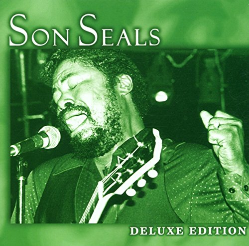 "CD album cover with man singing into microphone, green tint, 'Son Seals Deluxe Edition'."