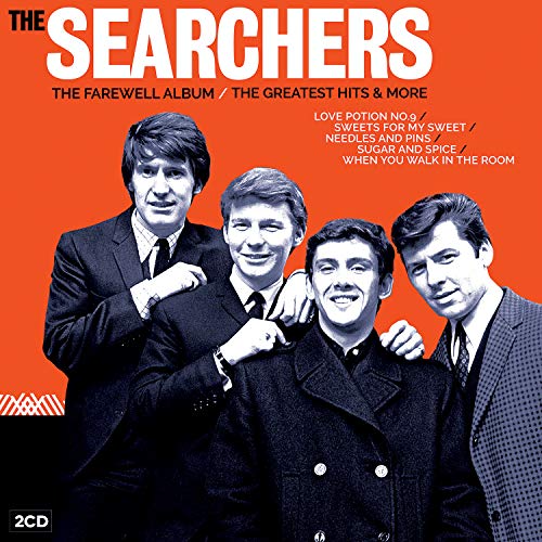 "CD cover with four men in suits on orange background, titled 'The Searchers'."