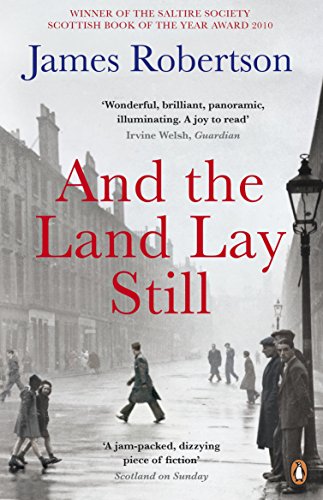 "Book cover with 'And the Land Lay Still' title, black-and-white city street scene."