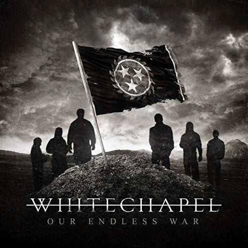 "Album cover with silhouetted figures around a flag on a mound, dark cloudy sky."