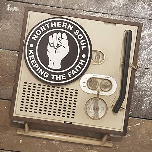 A beige, vintage radio with a "Northern Soul: Keeping the Faith" vinyl record.
