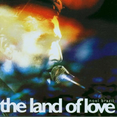 Album cover with a man singing into a microphone, colorful background.