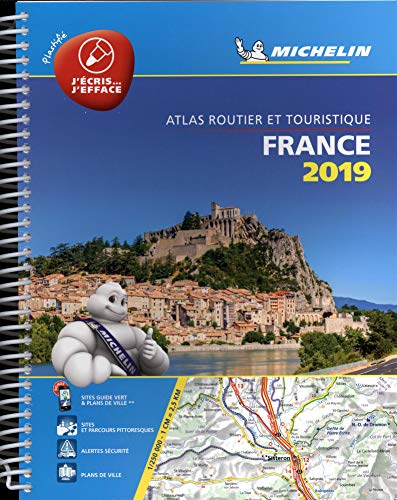 "Spiral-bound atlas cover featuring a town on a hillside and Michelin Man mascot."