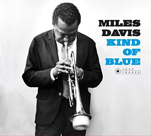 Black and white image of Miles Davis playing trumpet on album cover.