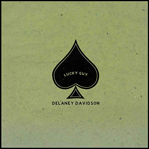 A vinyl record cover featuring a black spade symbol on a greenish-gray background.