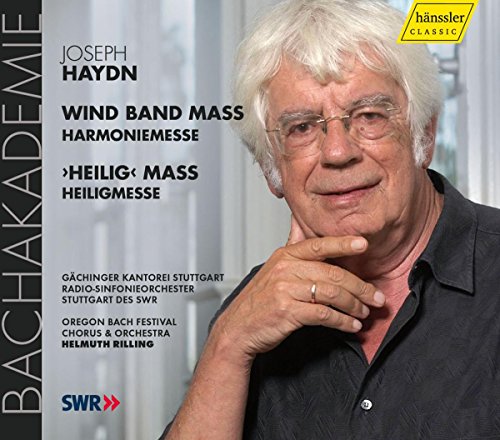 CD cover featuring a man with white hair, wearing a black shirt, against a blurred background.