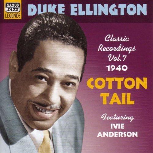 "Duke Ellington album cover with a smiling man and purple background."
