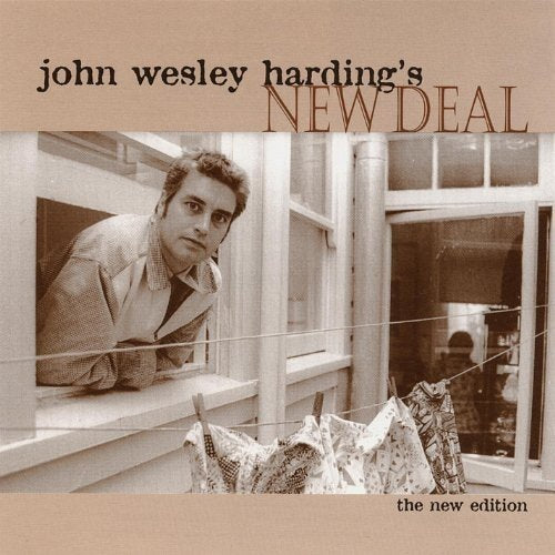 "Album cover with sepia-toned man leaning on a windowsill with clothes hanging."