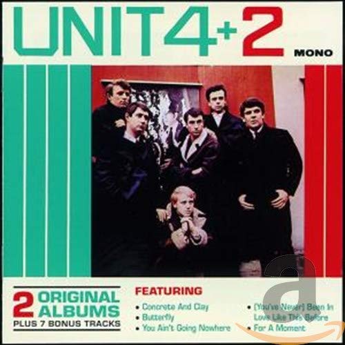 "Album cover featuring a group of men in dark clothing posing together."