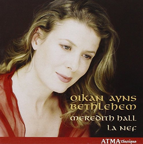 "CD cover featuring a woman with blonde hair and red blouse."