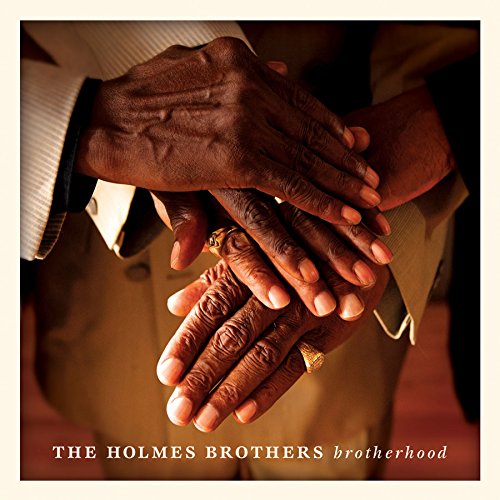 "Album cover showing three dark-skinned hands clasped together, with text 'The Holmes Brothers brotherhood'."