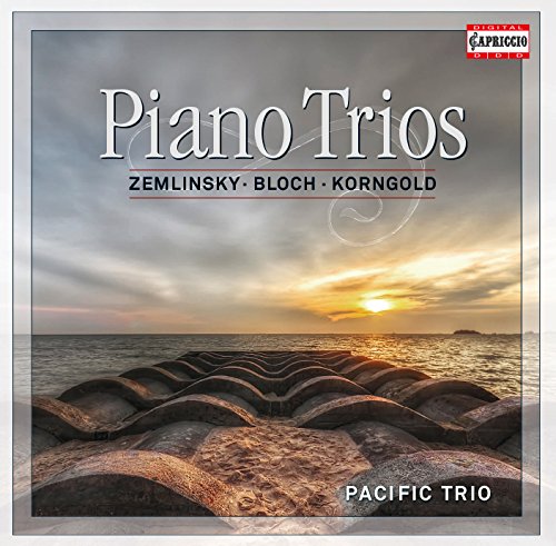 "CD cover with a rocky beach at sunset, titled 'Piano Trios' by Pacific Trio."