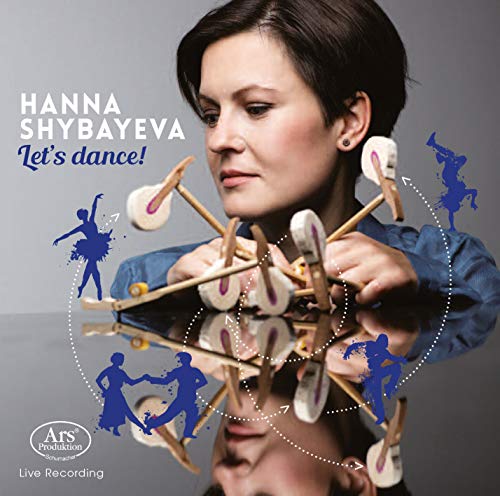 "CD cover featuring a woman playing xylophone with dancing silhouettes around her."
