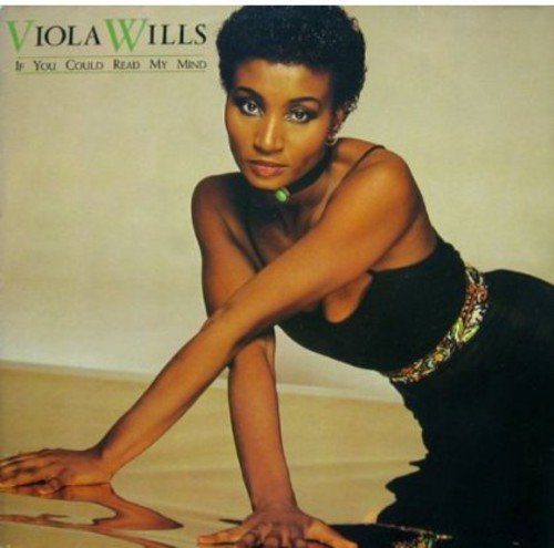 "Album cover featuring a woman in a black dress, crouching on the floor."