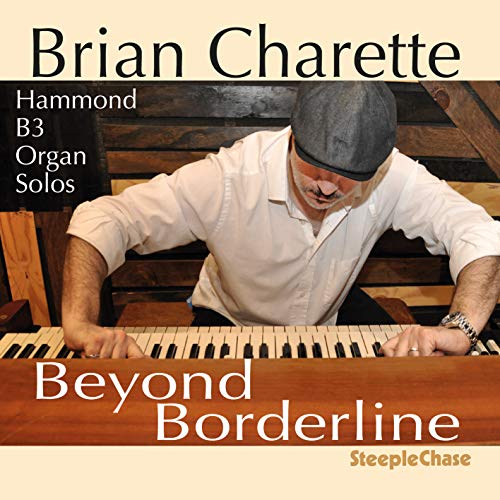 Album cover: man playing Hammond B3 organ, wearing white shirt and black beret.
