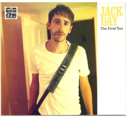 Man in white t-shirt with guitar strap on album cover titled "Jack Day - The First Ten".