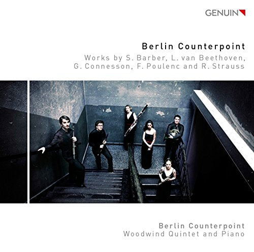 "CD cover featuring a group of musicians on a staircase, dressed in formal attire."
