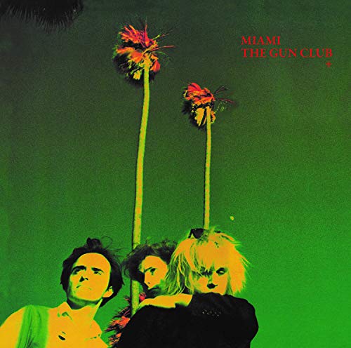 "Album cover with three people and dandelions on a green background, titled 'Miami The Gun Club'."