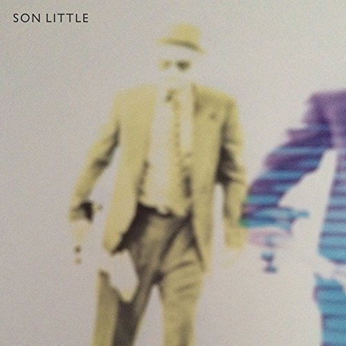 Vinyl record cover with a blurred man in a suit walking.