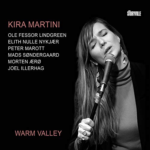 Black-and-white CD cover featuring a woman singing into a microphone, with artist and album name.