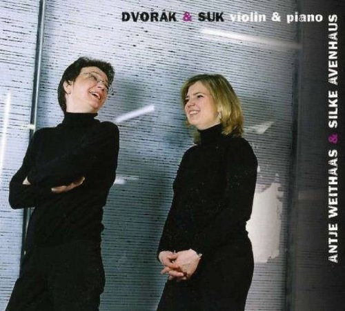 CD cover featuring a man and woman in black against a metallic background.