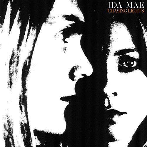 "Album cover with a black-and-white image of a woman's face, partially shadowed."