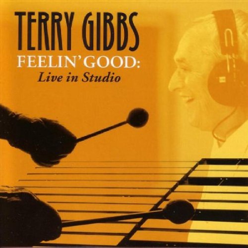 "CD cover featuring a man playing vibraphone, wearing headphones, with orange-toned background and text."