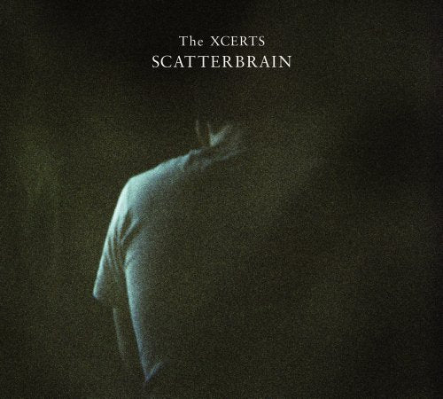 Album cover for "The Xcerts - Scatterbrain" featuring a person in a dark, shadowy background.