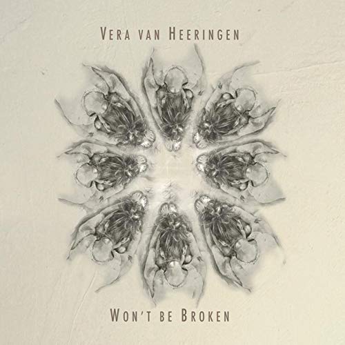 The image is a CD cover featuring a symmetrical, grayscale floral design. Alt text: "Grayscale CD cover with symmetrical floral design and artist name 'Vera van Heeringen'."
