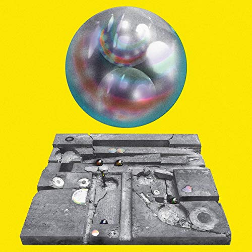 The image depicts a vinyl record cover with a bubble and cracked concrete on a yellow background.