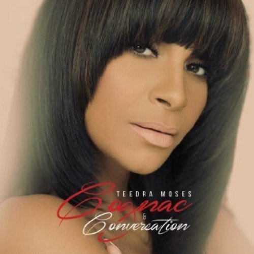 The alt text for the image is: "Album cover featuring a woman with dark hair and bangs."