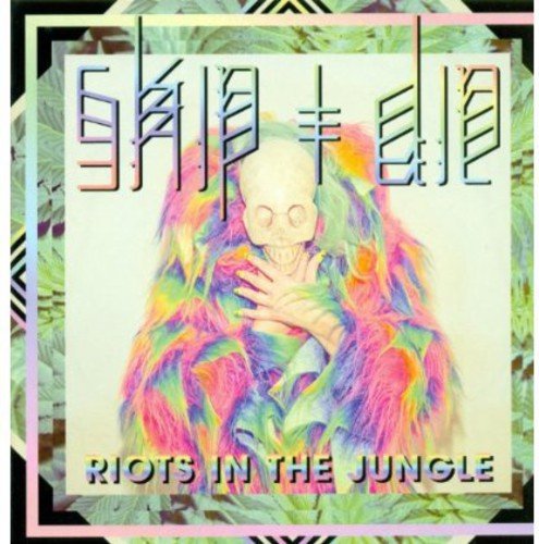 Album cover with colorful gorilla and skull, surrounded by green leaves on black background.