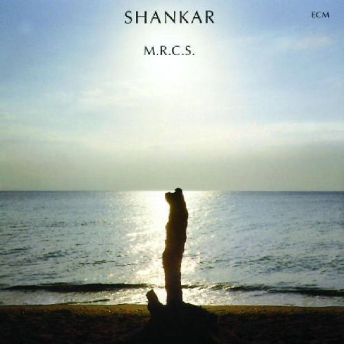 "Album cover featuring a silhouette of a person on a beach at sunrise."