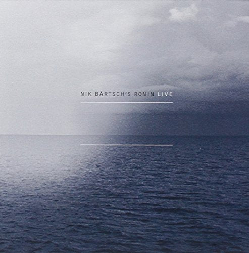 "CD cover featuring a serene ocean scene with cloudy sky and text overlay."