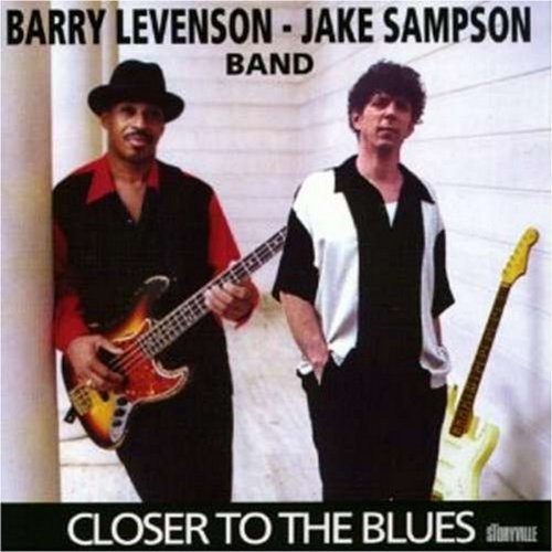 "Album cover with two men holding guitars, titled 'Closer to the Blues'."