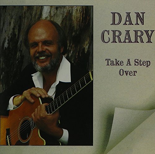 Album cover with man holding guitar, artist name "Dan Crary" and title "Take A Step Over".