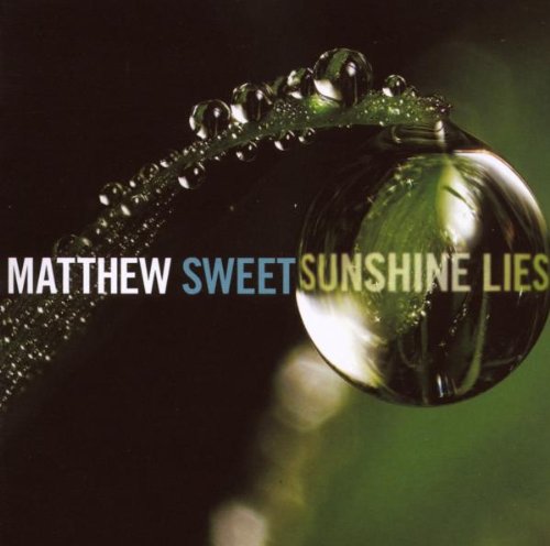 "Album cover featuring a water droplet on a green stem with artist and title text."