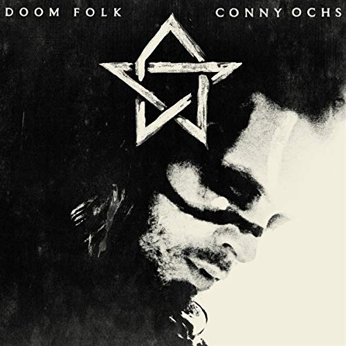 "Black and white vinyl album cover with a man's profile and a pentagram."