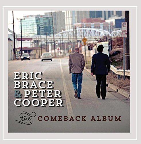 "Album cover with two men walking down a city street."