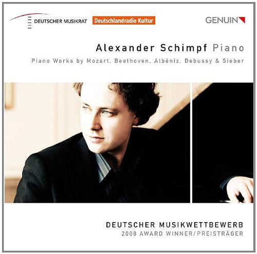"CD cover featuring a man playing piano with text describing the album."